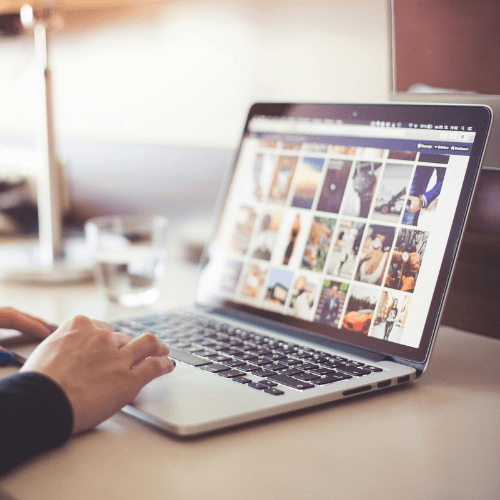 A person using a laptop to browse the internet
